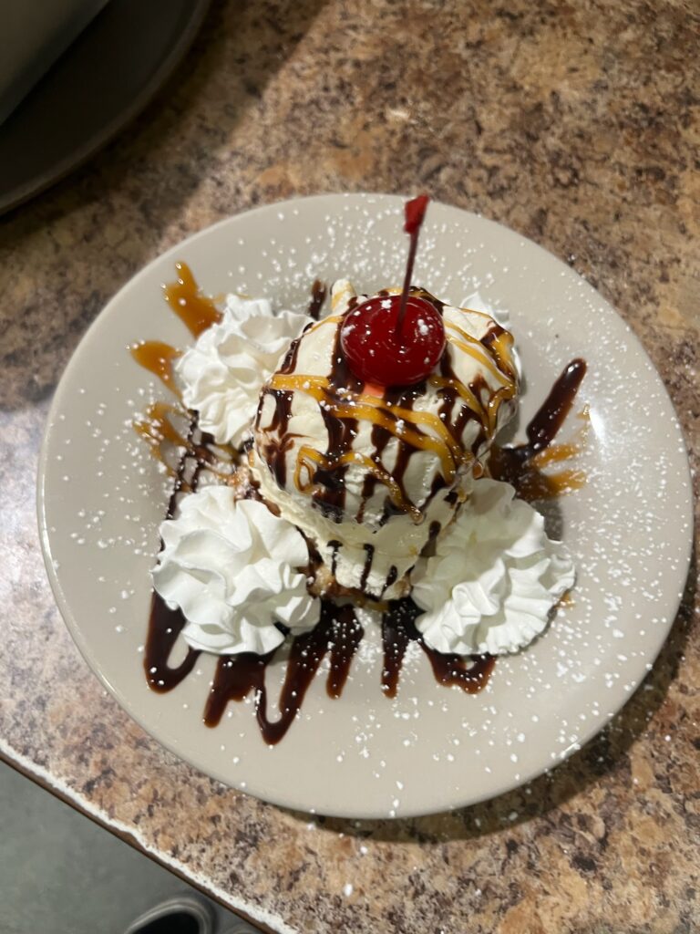 Waffle Sundae - belgian liege waffle, vanilla ice cream, chocolate sauce, caramel sauce, cherry